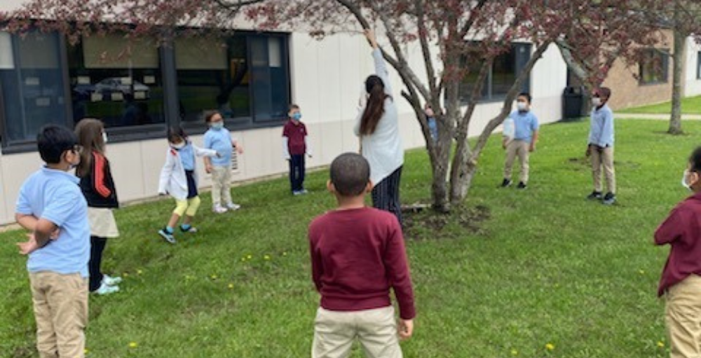 First grade students celebrated Earth Day by creating a bird feeder out of upcycled material.