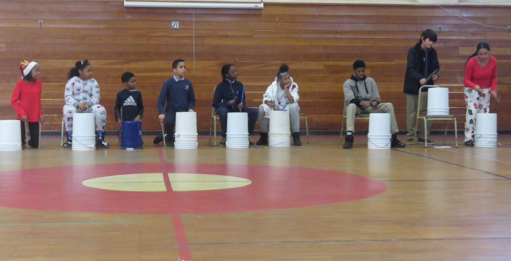 Middle school Atoms enjoyed jamming in a ‘drumline’ on buckets during their festivities leading up to winter recess