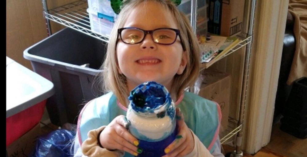 Utica Academy of Science elementary school student created a spring inspired science experiment called Cloud in a Jar.